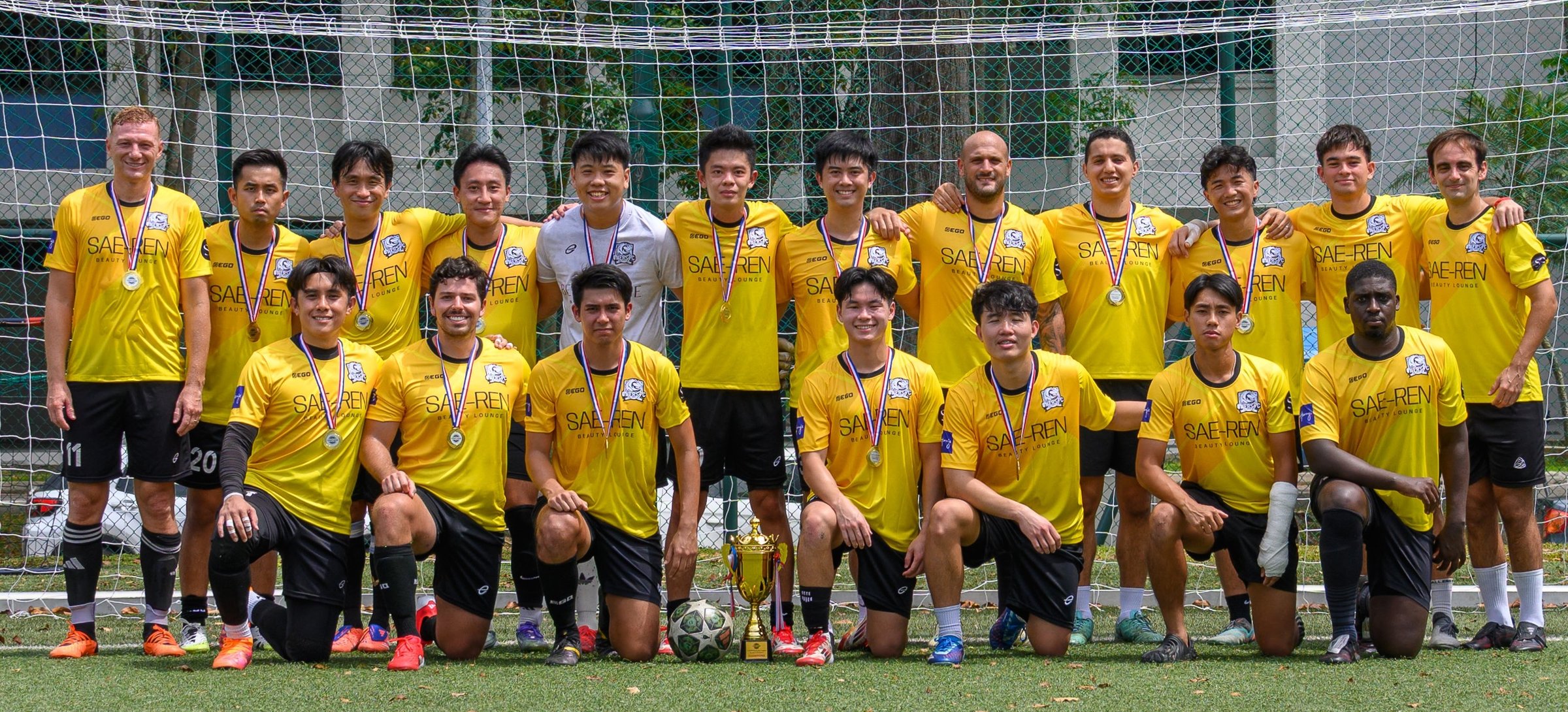 ONERS FC team with the trophy after a match